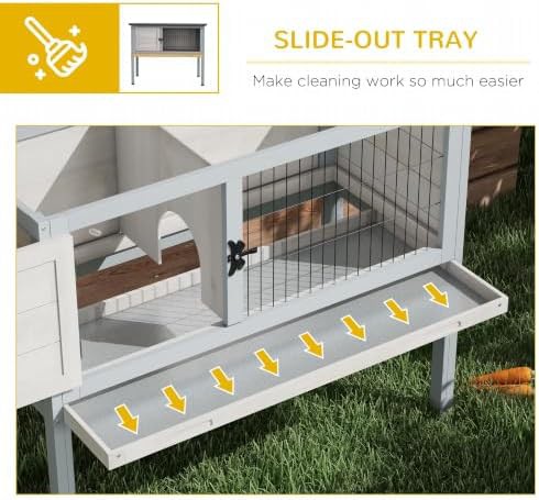 Elevated light gray wooden rabbit hutch — photo 5