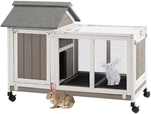 Grey wooden rabbit hutch with asphalt roof